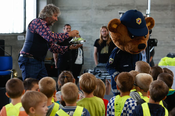 first graders being hand over their prizes